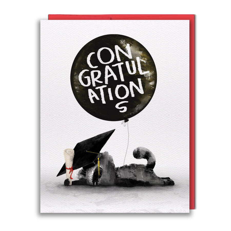 Greeting Card featuring a raccoon lying face down on the floor holding a diploma and mortar cap, with a big "Congratulations" balloon