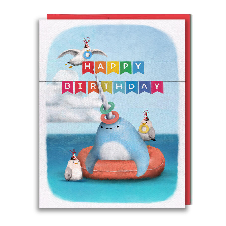 Greeting card featuring a narwhal in the water while seagulls toss rings onto its horn, with a Happy Birthday banner